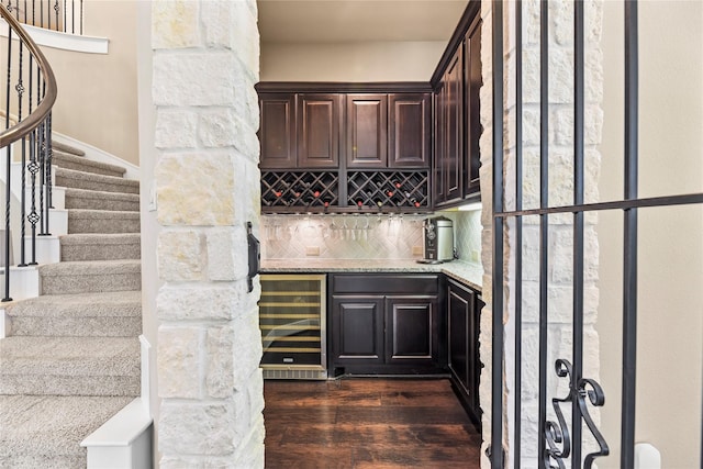 27710 Bering Crossing Dr, Katy, TX 77494 - wine room featuring wine cooler, a dry bar, and dark wood-style floors
