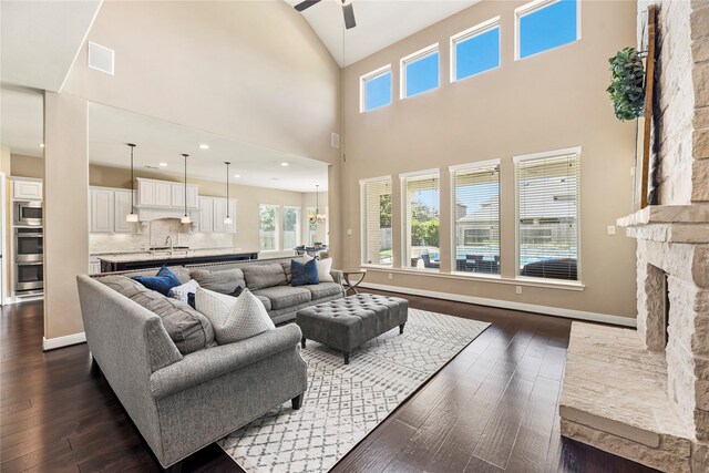 27710 Bering Crossing Dr, Katy, TX 77494 - living room featuring ceiling fan, dark wood-style floors, a towering ceiling, and baseboards