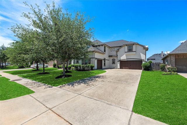 27710 Bering Crossing Dr, Katy, TX 77494 - view of front facade with an attached garage, driveway, and stucco siding