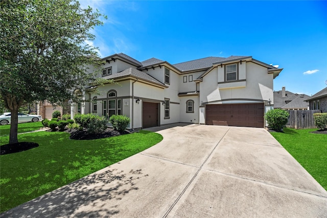 27710 Bering Crossing Dr, Katy, TX 77494 - french country home featuring stucco siding, an attached garage, and driveway