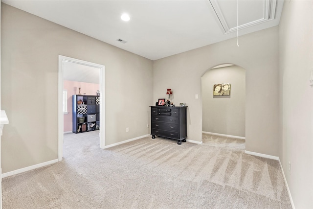 27710 Bering Crossing Dr, Katy, TX 77494 - carpeted empty room with attic access, baseboards, arched walkways, and recessed lighting