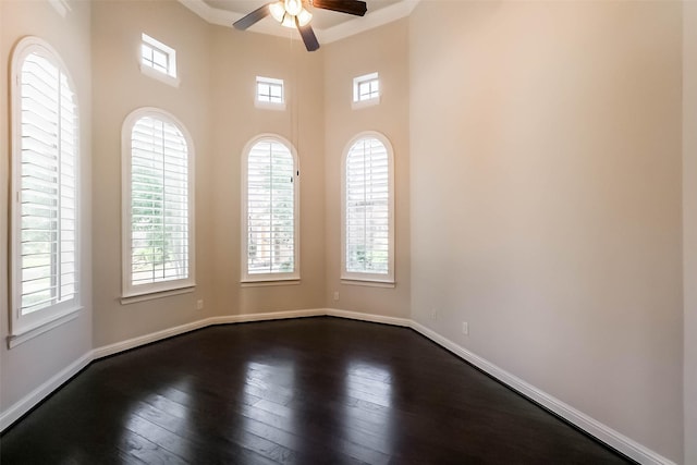 3322 Mallard Run Ct, Katy, TX 77494 - empty room with plenty of natural light, a ceiling fan, dark wood-style flooring, and baseboards