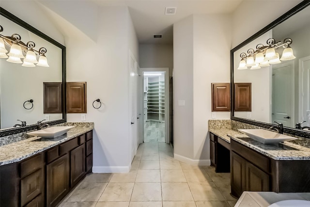 3322 Mallard Run Ct, Katy, TX 77494 - full bathroom with two vanities, baseboards, and tile patterned floors