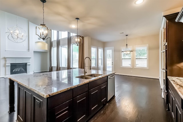 3322 Mallard Run Ct, Katy, TX 77494 - kitchen featuring a sink, appliances with stainless steel finishes, dark wood finished floors, an island with sink, and a chandelier