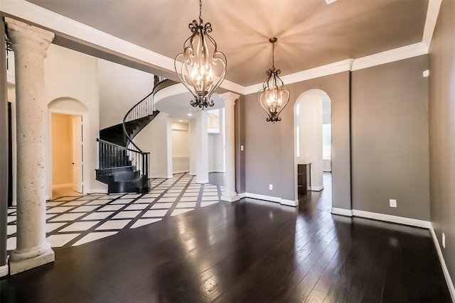 3322 Mallard Run Ct, Katy, TX 77494 - unfurnished dining area with arched walkways, stairs, baseboards, wood finished floors, and a chandelier