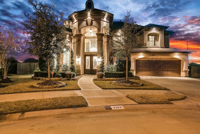 3322 Mallard Run Ct, Katy, TX 77494 - view of front facade featuring an attached garage, french doors, stucco siding, and concrete driveway