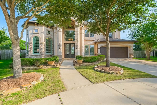 3322 Mallard Run Ct, Katy, TX 77494 - view of front facade featuring french doors, stone siding, stucco siding, concrete driveway, and an attached garage