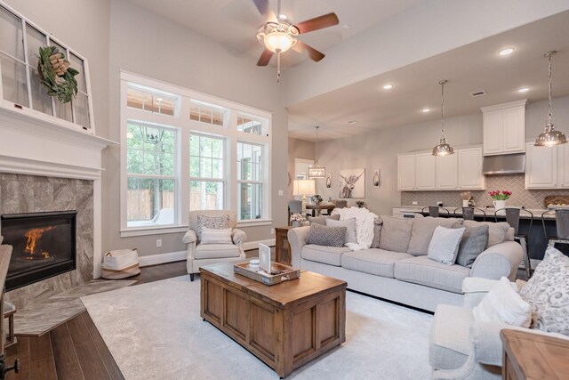 151 Jacks Corner Dr, Montgomery, TX 77316 - living room with light wood-style floors, ceiling fan, a fireplace, recessed lighting, and baseboards