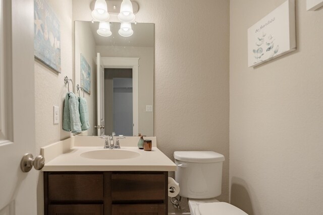 151 Jacks Corner Dr, Montgomery, TX 77316 - half bath featuring toilet, vanity, and a textured wall