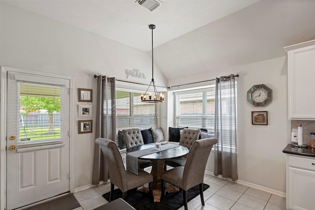 2506 Abernathy Glen Ct, Houston, TX 77014 - dining room with plenty of natural light, a chandelier, light tile patterned flooring, and lofted ceiling