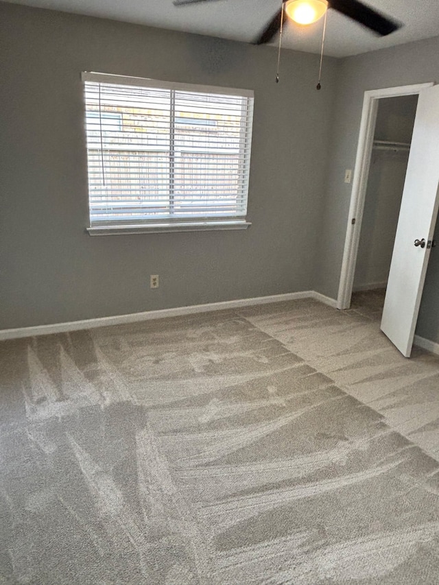 815 Pebbleshire Dr, Houston, TX 77062 - unfurnished bedroom featuring carpet, baseboards, ceiling fan, and a closet
