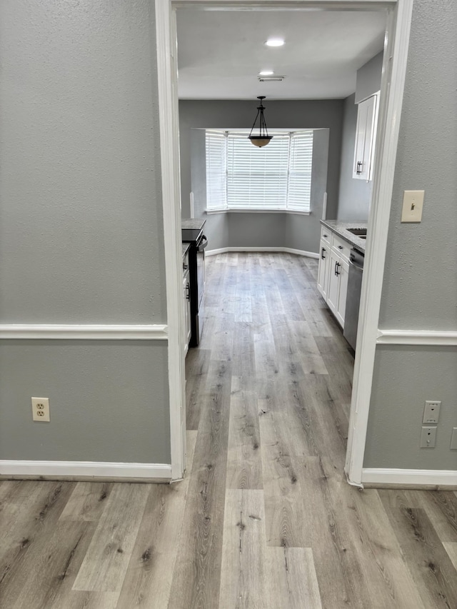 815 Pebbleshire Dr, Houston, TX 77062 - corridor with light wood finished floors and baseboards
