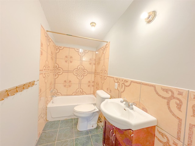 403 Fern Ln, Wharton, TX 77488 - full bath featuring toilet, shower / washtub combination, vanity, tile patterned flooring, and a textured ceiling