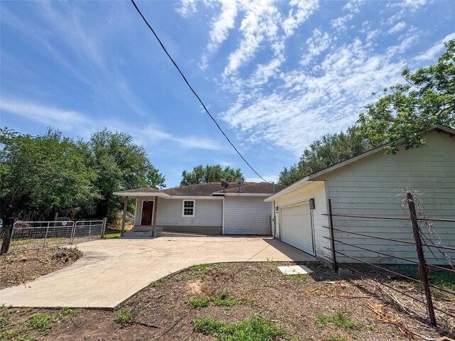 403 Fern Ln, Wharton, TX 77488 - back of house with a garage