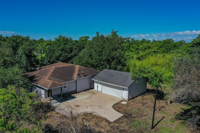 403 Fern Ln, Wharton, TX 77488 - aerial view of property and surrounding area with a heavily wooded area