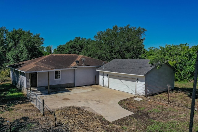403 Fern Ln, Wharton, TX 77488 - ranch-style house with a garage and a shingled roof