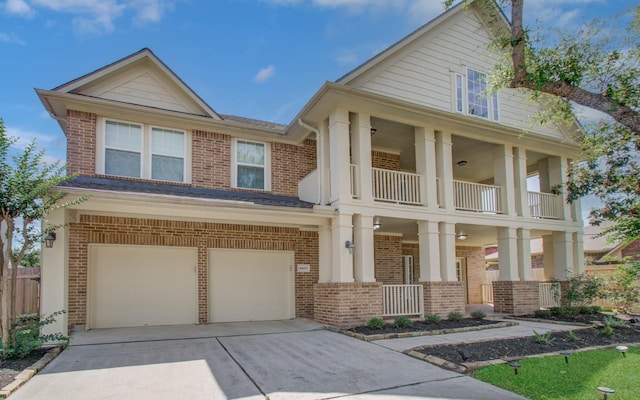 6410 Drayton Hall, Missouri City, TX 77459 - view of front of property with brick siding, a garage, a balcony, a porch, and driveway