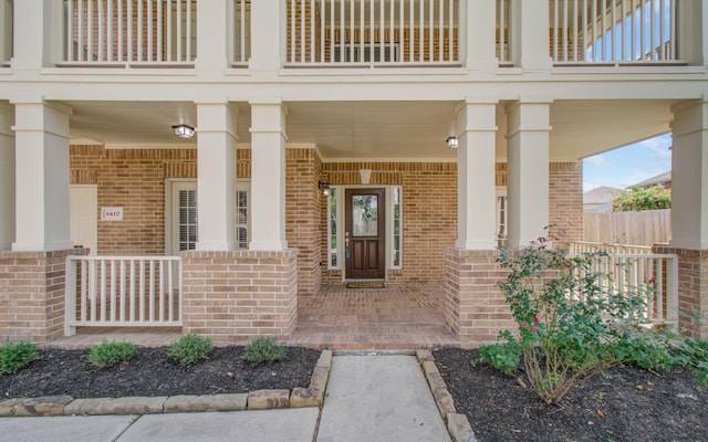 6410 Drayton Hall, Missouri City, TX 77459 - property entrance with brick siding, covered porch, and a balcony
