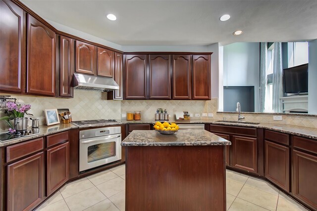 6410 Drayton Hall, Missouri City, TX 77459 - kitchen with oven, under cabinet range hood, a sink, electric cooktop, and dark stone countertops