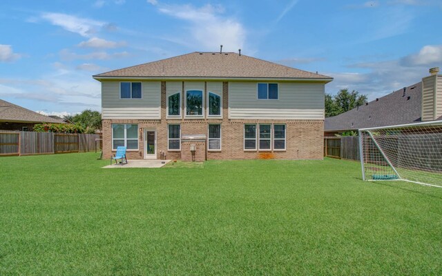 6410 Drayton Hall, Missouri City, TX 77459 - back of property featuring brick siding, a fenced backyard, and a patio