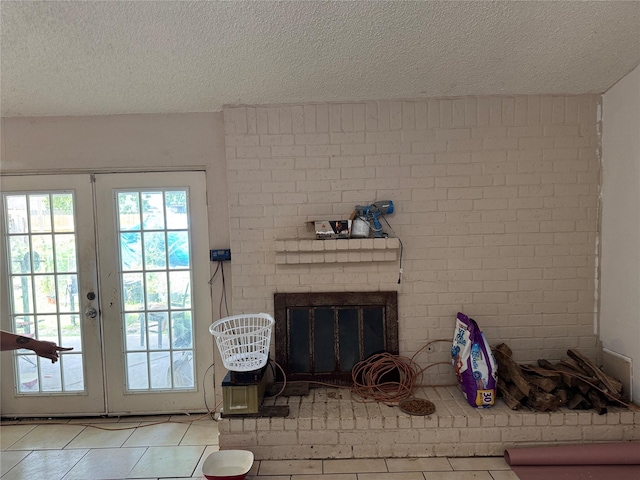 5319 Straight Arrow Dr, Humble, TX 77346 - living area with tile patterned flooring, a textured ceiling, french doors, and a fireplace