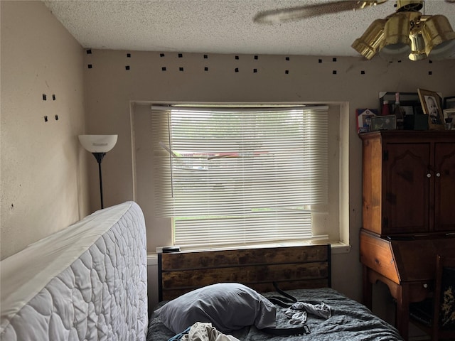 5319 Straight Arrow Dr, Humble, TX 77346 - bedroom featuring a textured ceiling and a ceiling fan