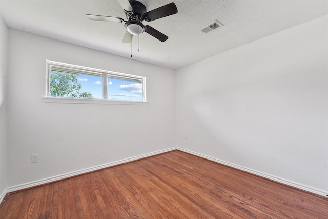 2635 Dragonwick Dr, Houston, TX 77045 - spare room with baseboards, wood finished floors, and ceiling fan