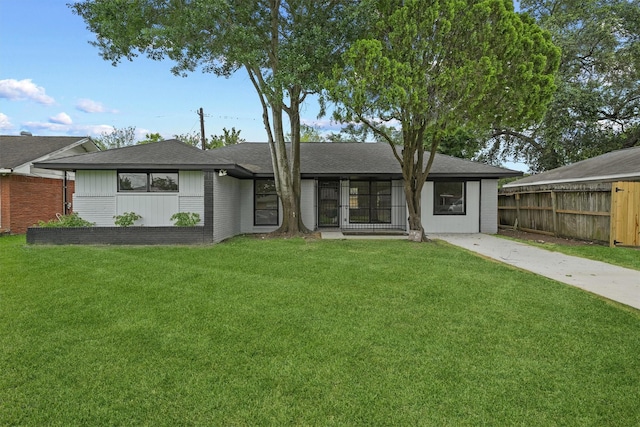 2635 Dragonwick Dr, Houston, TX 77045 - view of front facade with roof with shingles and brick siding
