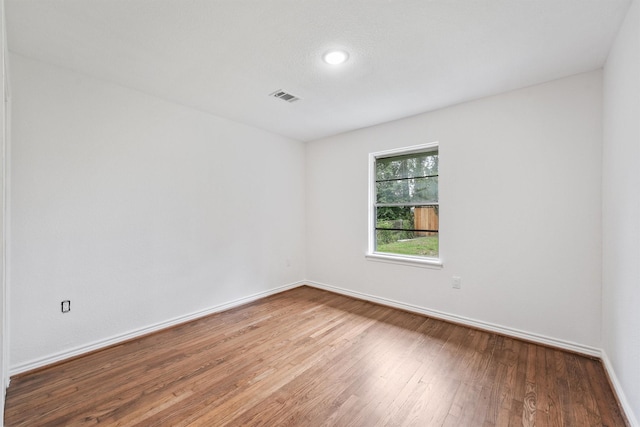 2635 Dragonwick Dr, Houston, TX 77045 - spare room with wood finished floors, baseboards, and recessed lighting