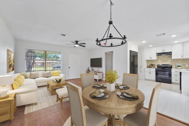 2635 Dragonwick Dr, Houston, TX 77045 - dining space featuring light wood-style flooring, a ceiling fan, and recessed lighting