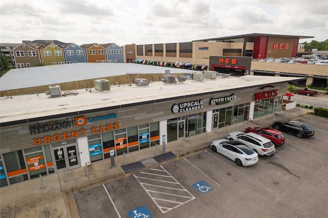 724 W 24th St, Houston, TX 77008 - view of commercial property with uncovered parking and central air condition unit