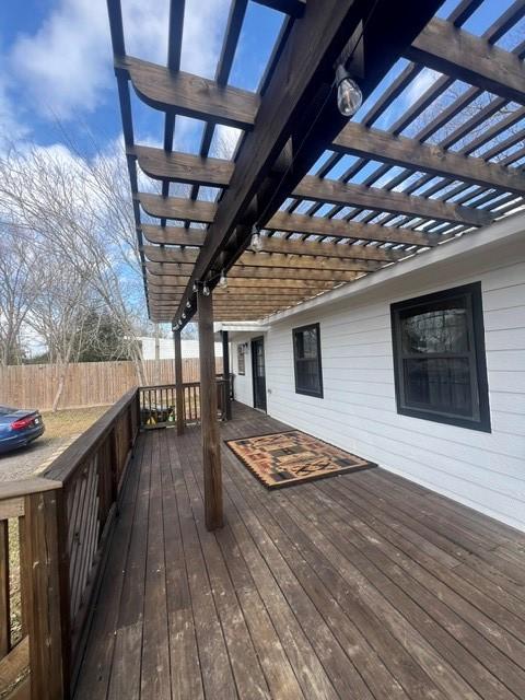 327 3rd St, Dickinson, TX 77539 - wooden terrace with a pergola