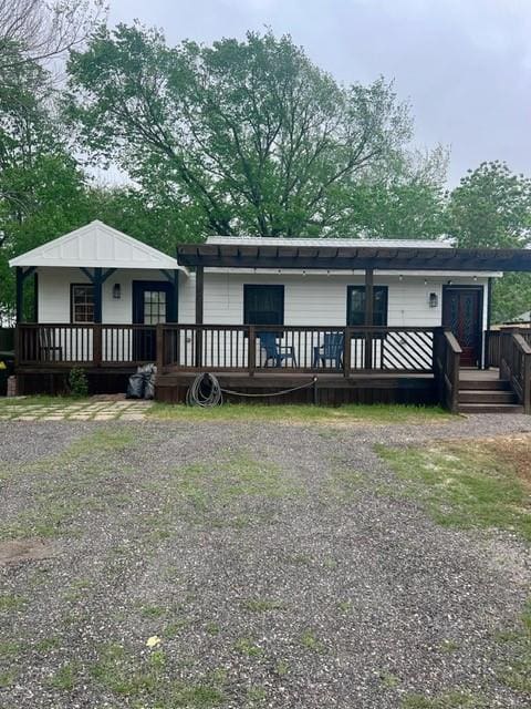 327 3rd St, Dickinson, TX 77539 - view of front of home with a deck