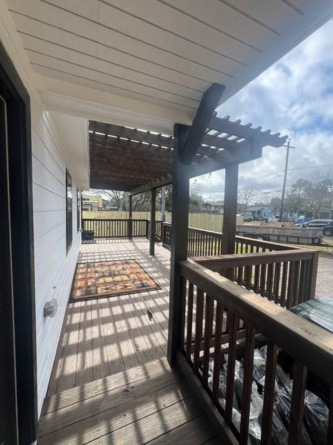 327 3rd St, Dickinson, TX 77539 - wooden deck with a pergola