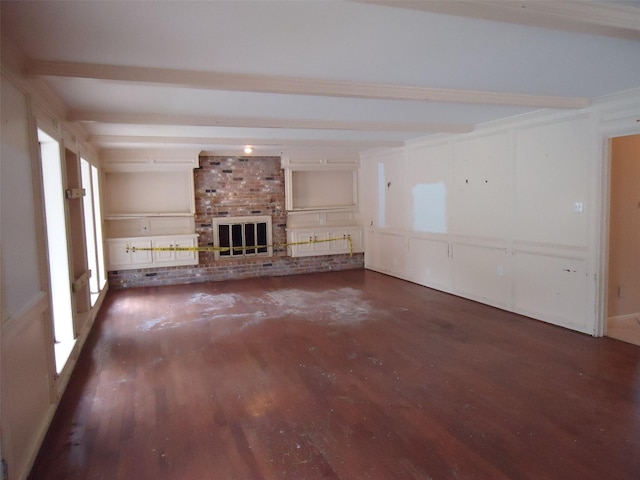 3823 Kiamesha Dr, Missouri City, TX 77459 - unfurnished living room with beamed ceiling, wood finished floors, and a brick fireplace