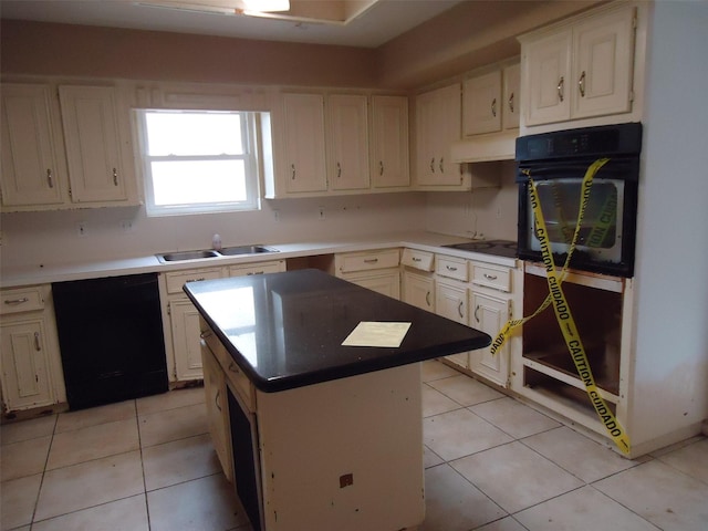 3823 Kiamesha Dr, Missouri City, TX 77459 - kitchen featuring black appliances, a sink, light tile patterned flooring, a center island, and under cabinet range hood