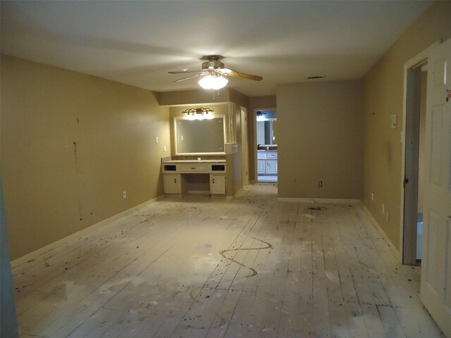 3823 Kiamesha Dr, Missouri City, TX 77459 - unfurnished living room with light wood-style floors, ceiling fan, and baseboards