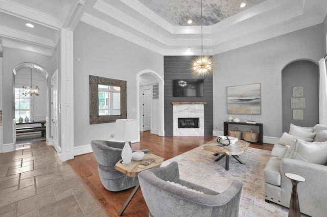 28310 Whispering Maple Way, Spring, TX 77386 - living room featuring healthy amount of natural light, arched walkways, ornamental molding, a high ceiling, and recessed lighting