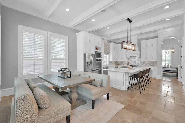 28310 Whispering Maple Way, Spring, TX 77386 - dining room featuring a chandelier, beamed ceiling, recessed lighting, stone tile floors, and baseboards