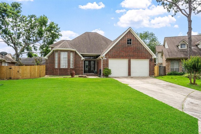 15110 Farndale Dr, Houston, TX 77062 - view of front facade featuring french doors, brick siding, concrete driveway, an attached garage, and roof with shingles