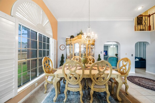 15110 Farndale Dr, Houston, TX 77062 - tiled dining room with a chandelier, ornamental molding, arched walkways, healthy amount of natural light, and baseboards