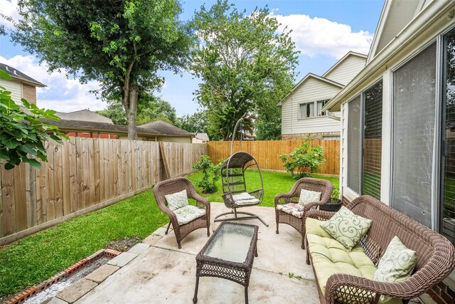 15110 Farndale Dr, Houston, TX 77062 - fenced backyard with a patio area and outdoor lounge area