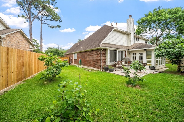 15110 Farndale Dr, Houston, TX 77062 - back of property featuring brick siding, a patio area, a chimney, a shingled roof, and french doors
