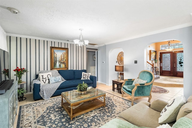 15110 Farndale Dr, Houston, TX 77062 - living room with arched walkways, a chandelier, ornamental molding, light tile patterned floors, and baseboards