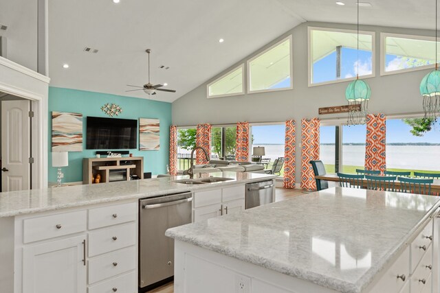 209 Anchor Ranch Rd, Trinidad, TX 75163 - kitchen with stainless steel dishwasher, a sink, open floor plan, a kitchen island, and high vaulted ceiling
