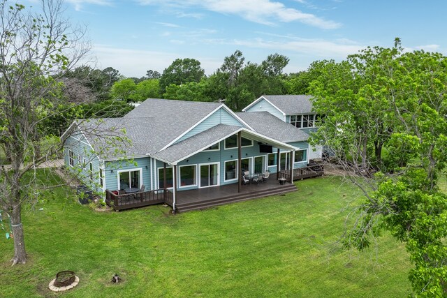 209 Anchor Ranch Rd, Trinidad, TX 75163 - back of property with a shingled roof, a lawn, and a wooden deck
