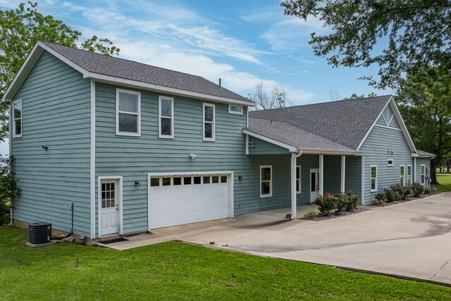 209 Anchor Ranch Rd, Trinidad, TX 75163 - view of front facade featuring driveway, central air condition unit, a front lawn, an attached garage, and a shingled roof
