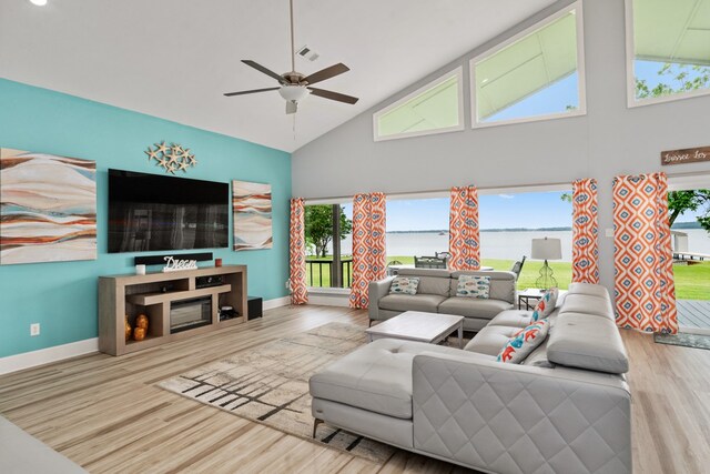 209 Anchor Ranch Rd, Trinidad, TX 75163 - living room with high vaulted ceiling, a ceiling fan, wood finished floors, and baseboards