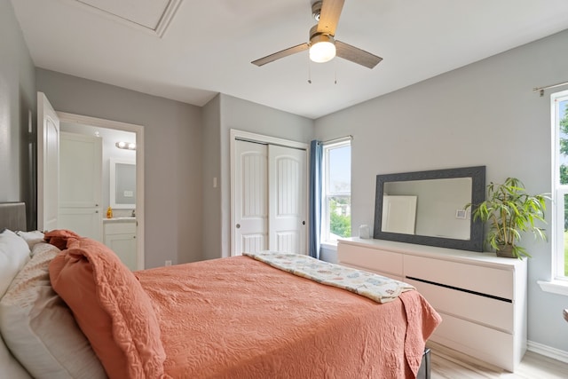 209 Anchor Ranch Rd, Trinidad, TX 75163 - bedroom with a closet, light wood-style flooring, ensuite bathroom, baseboards, and a ceiling fan