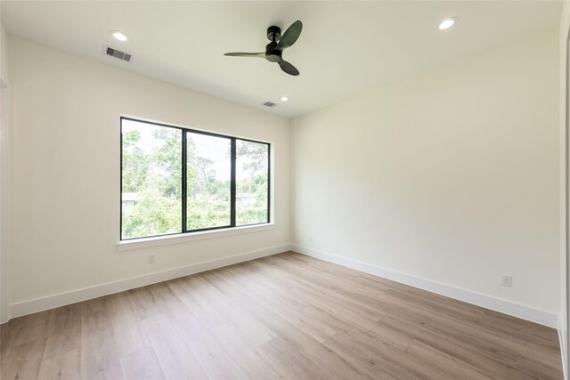 6137 Pacific Forest Dr, Houston, TX 77346 - empty room with light wood finished floors, a ceiling fan, baseboards, and recessed lighting